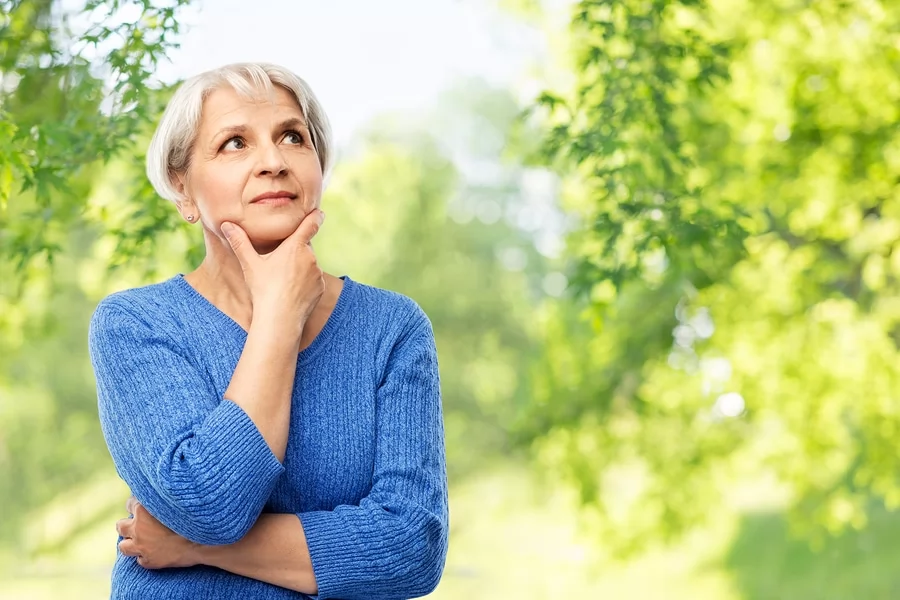 senior woman practicing memory exercises outdoors