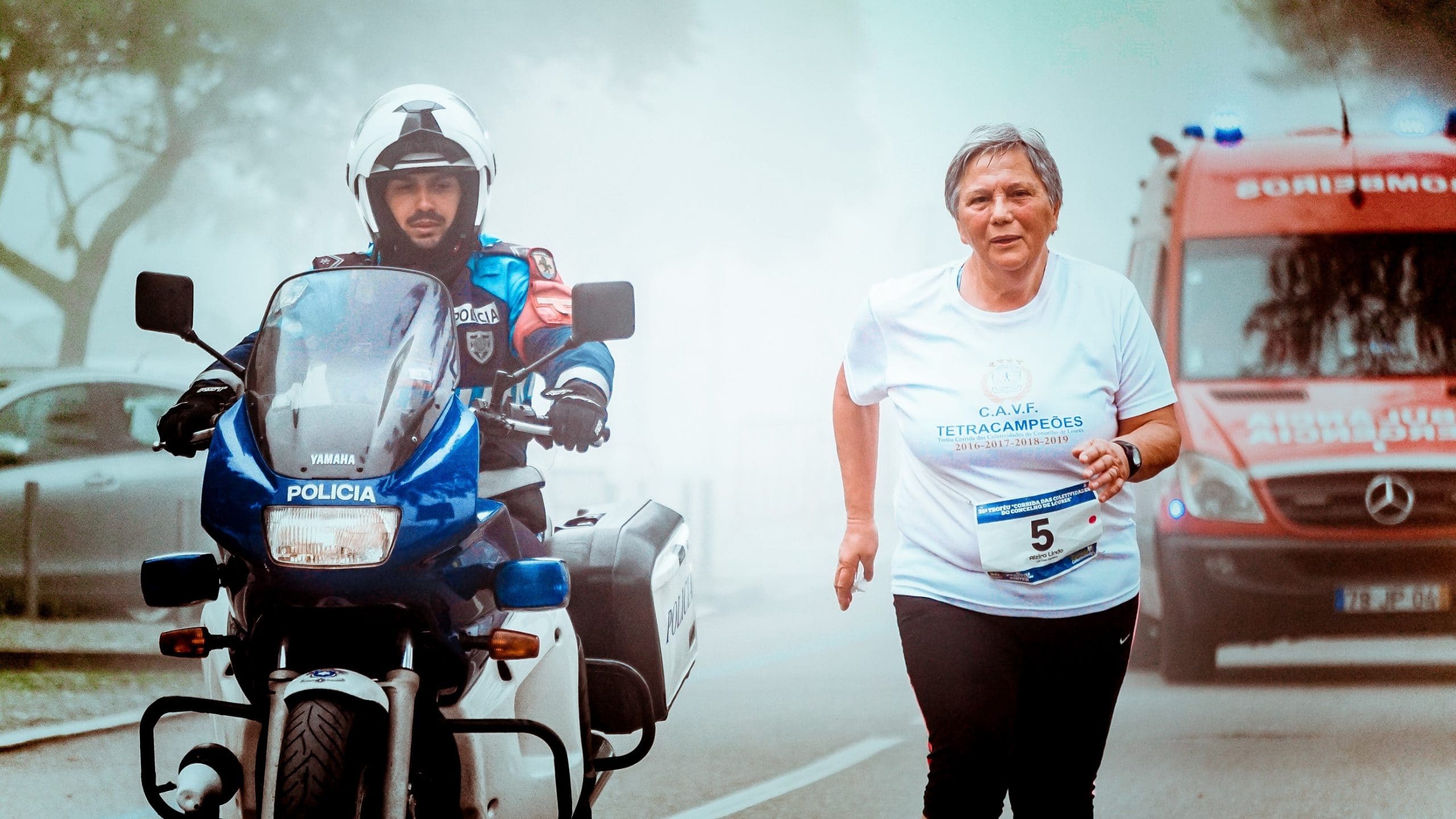senior woman improving mobility by participating in marathon run