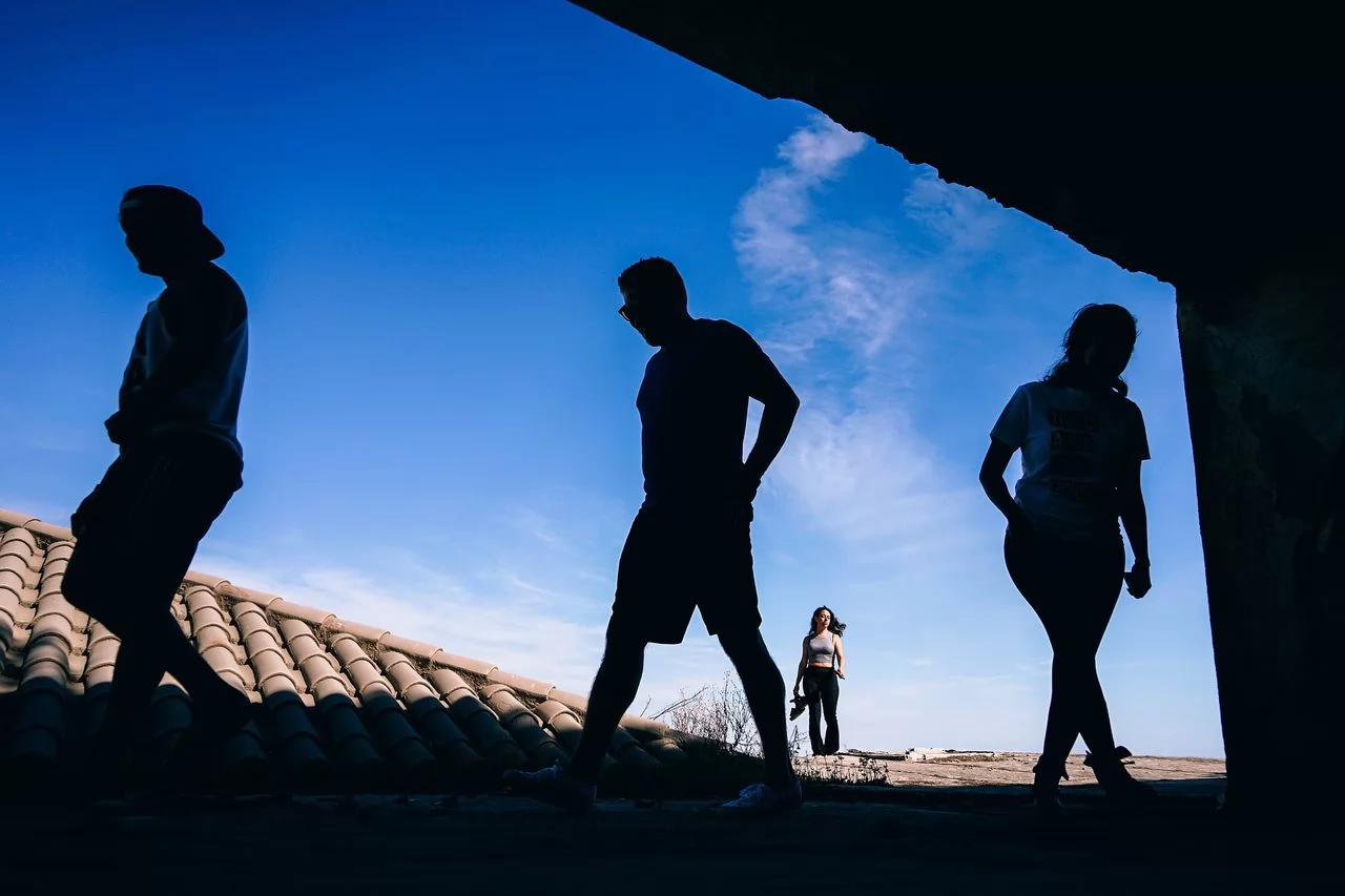 four young adults participating in social activities